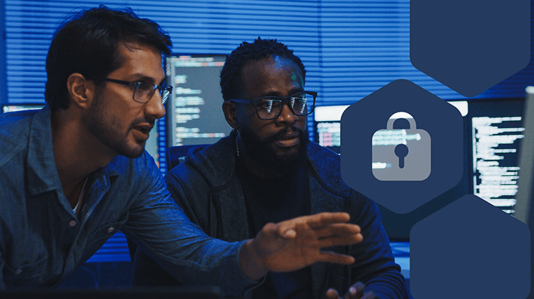 Black cybersecurity analyst monitoring threat detection alerts on multiple monitors